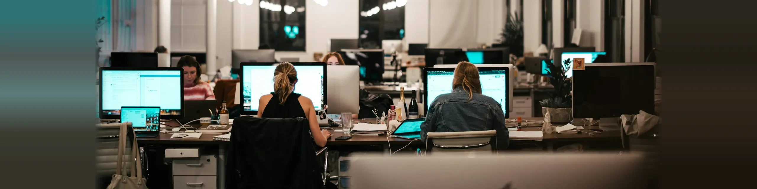 Support team working at their workstations in an open office